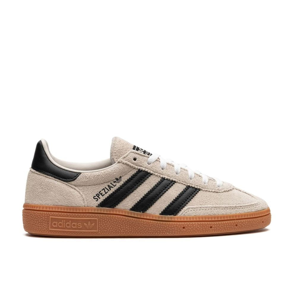 Side Image of Adidas Originals Handball Spezial Aluminum (W) (IF6562) on a white background. Suede uppers donned with the iconic Black Adidas stripes. Available now at TRM Exclusives.